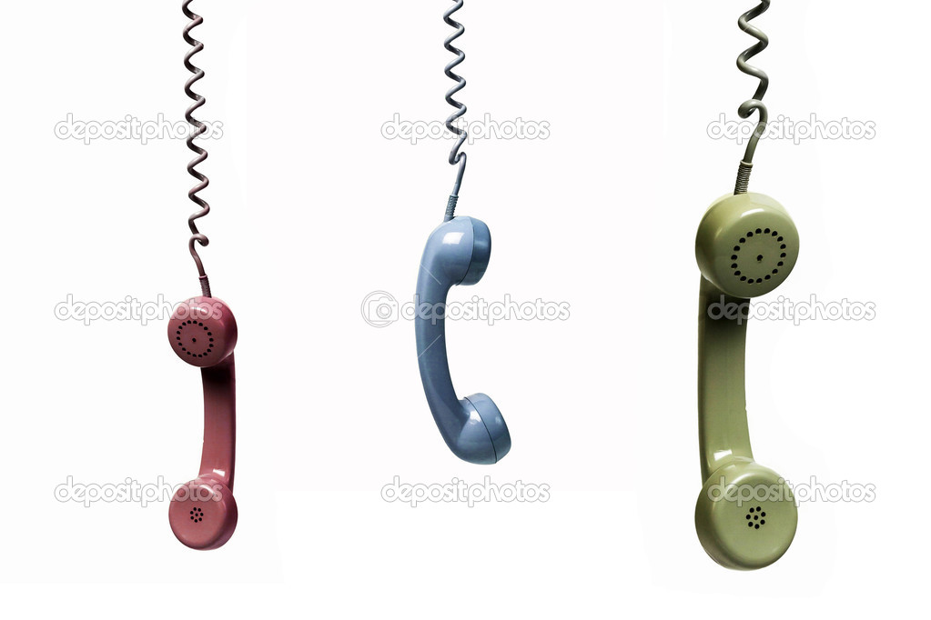 Three phones hanging from several colors isolated on a white bac