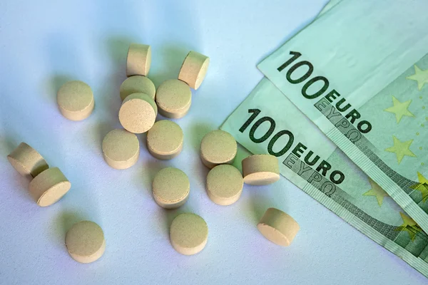 Pills and money, abstract business medical background — Stock Photo, Image
