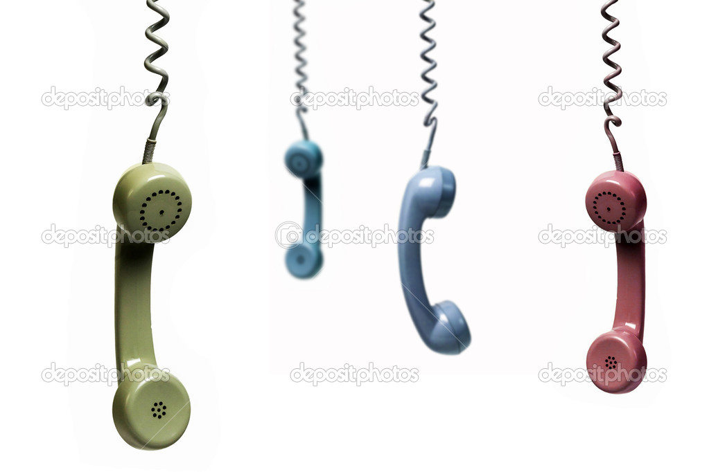 Four phones hanging from several colors isolated on a white back