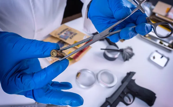 Criminalistic Laboratory Scientific Police Officer Holds Bullet Tips Tweezers Ballistic — Stock Photo, Image