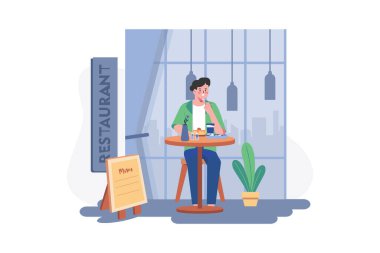 Man sitting in a restaurant and eating food