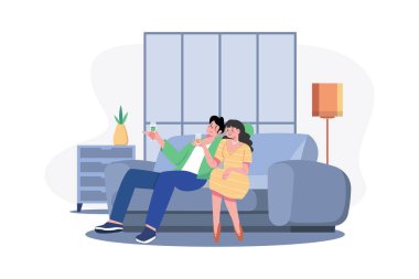 Young couple sitting at armchairs in the room holding wineglasses