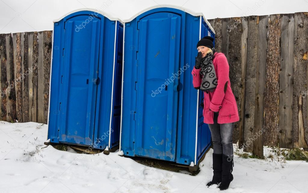 Woman waiting outside toilette