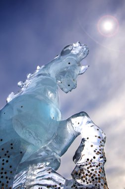 Horse ice statue with dramatic sky clipart