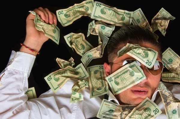 Business man on the floor covered with dollars — Stock Photo, Image