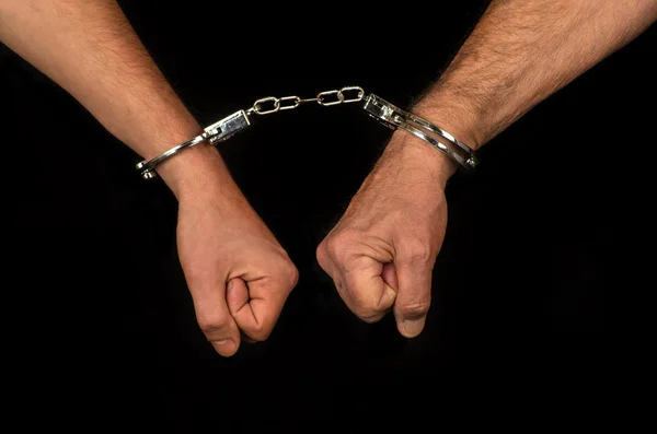 Handcuffed hands close up view — Stock Photo, Image