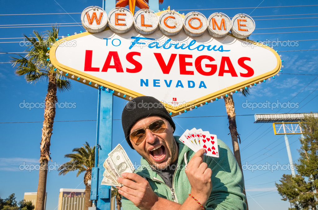 Gambler with dollars and royal flush in Las Vegas