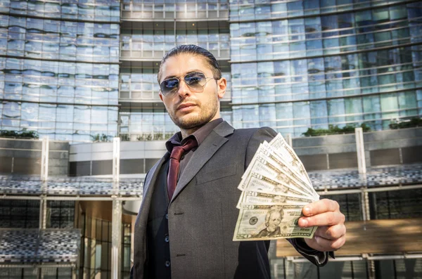 Business man holding money — Stock Photo, Image