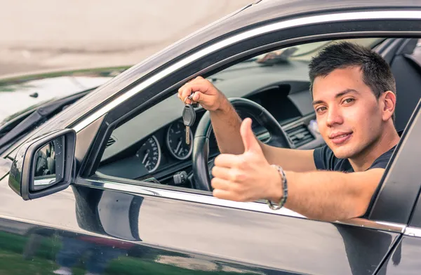 Happy man in his car — Stock Photo, Image
