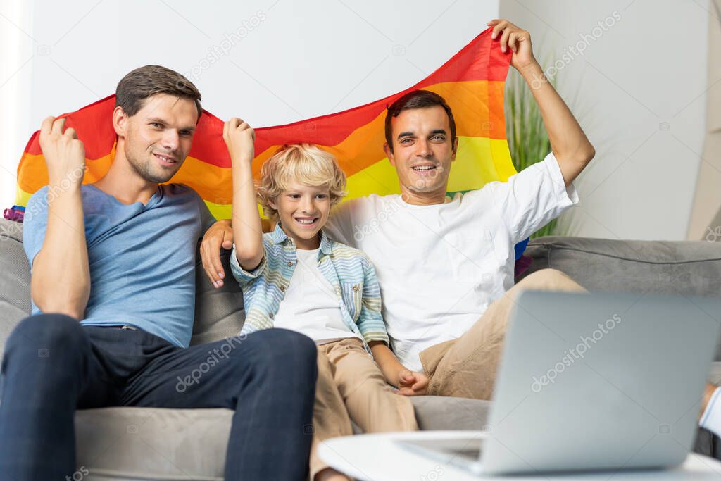 Lgbt family, gay couple with adopted son - Homosexual parents with their kid having fun at home