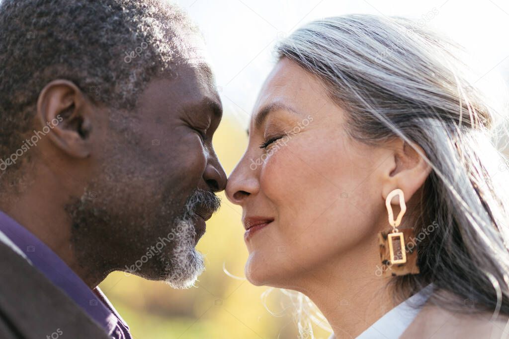 Storytelling image of a multiethnic senior couple in love