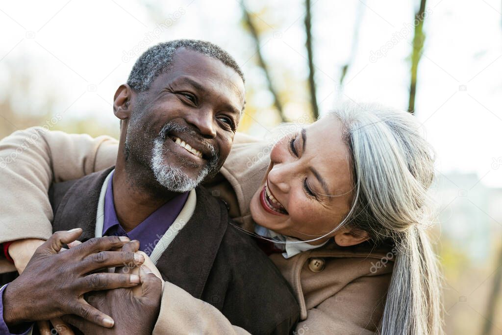 Storytelling image of a multiethnic senior couple in love