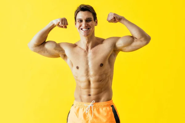 Handsome Man Posing Studio Wearing Beach Trunks — Zdjęcie stockowe