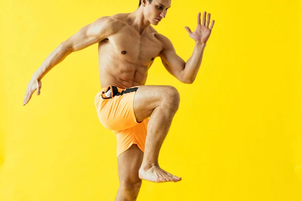 Handsome Man Posing Studio Wearing Beach Trunks — Zdjęcie stockowe