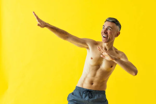 Handsome Senior Man Posing Studio Wearing Beach Trunks — Stock Photo, Image