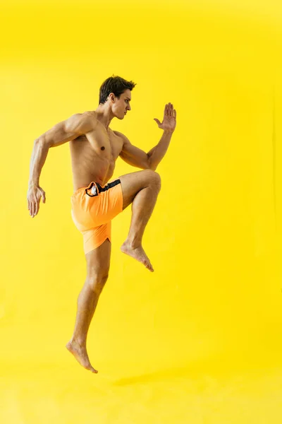 Handsome Man Posing Studio Wearing Beach Trunks — Fotografia de Stock