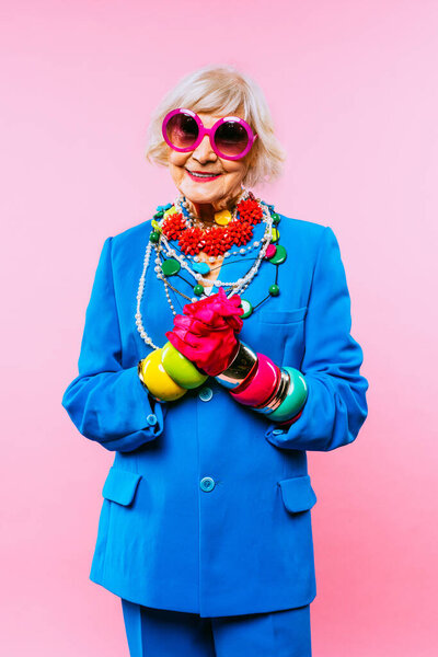 Happy and funny cool old lady with fashionable clothes portrait on colored background - Youthful grandmother with extravagant style, concepts about lifestyle, seniority and elderly people