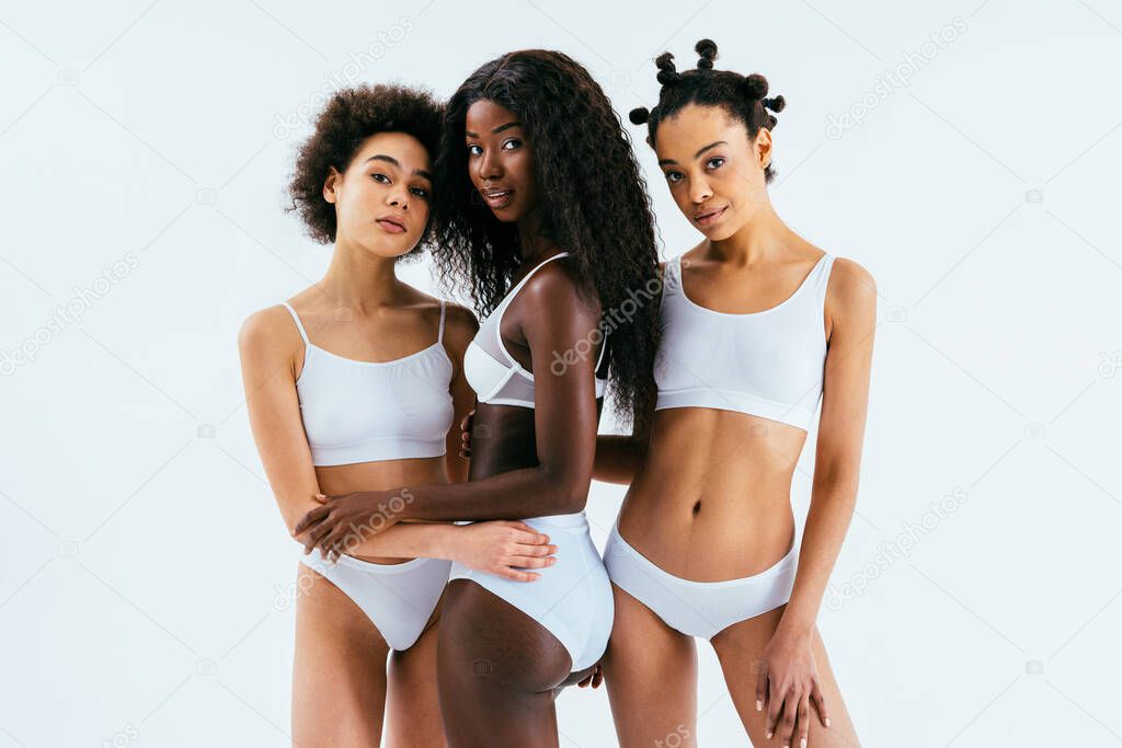 Beauty portrait of beautiful black women wearing lingerie underwear - Pretty african young women posing in studio, concepts about beauty, cosmetology and diversity