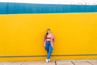 Beautiful and cheerful plus size young woman outdoors - Pretty overweight curvy female, concepts about femininity, women power, female emancipation, body positivity and body acceptance