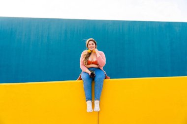 Beautiful and cheerful plus size young woman outdoors - Pretty overweight curvy female, concepts about femininity, women power, female emancipation, body positivity and body acceptance
