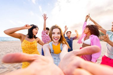 Multiethnic group of young happy friends bonding outside, having fun on summertime vacation - Multicultural cheerful people with summer clothes enjoying summer holidays, concepts about youth, friendship and positive emotion