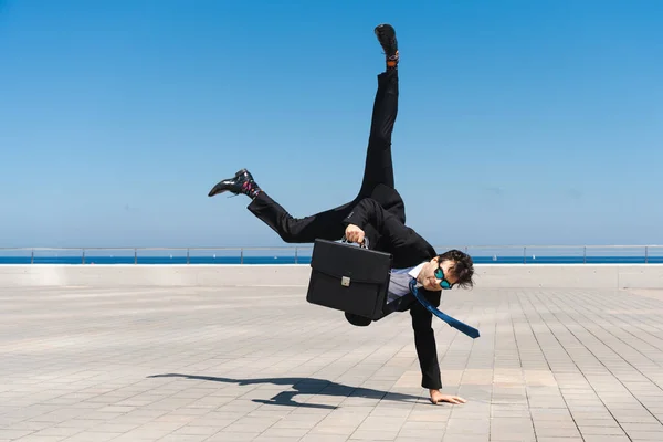 Happy Handsome Adult Businessman Wearing Elegant Suit Doing Acrobatic Trick — стоковое фото