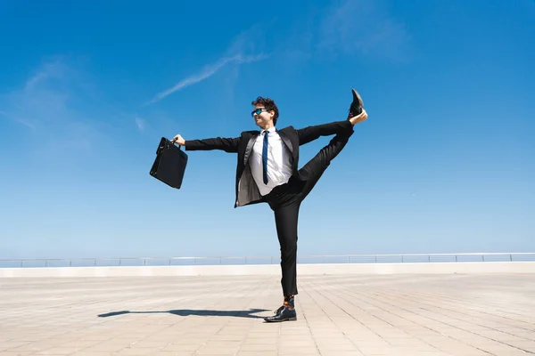 Happy Handsome Adult Businessman Wearing Elegant Suit Doing Acrobatic Trick — Fotografie, imagine de stoc