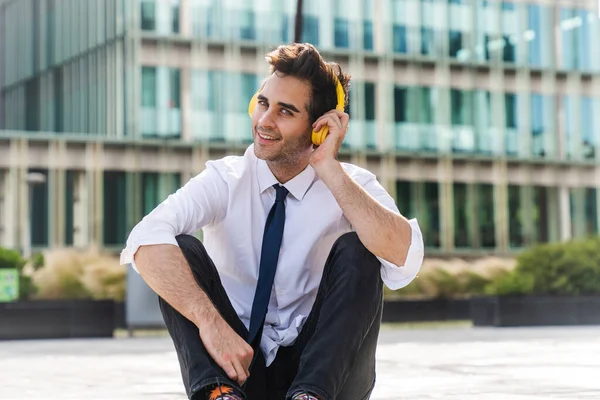 Happy Handsome Adult Businessman Wearing Elegant Suit Sitting Ground Listening — Foto Stock