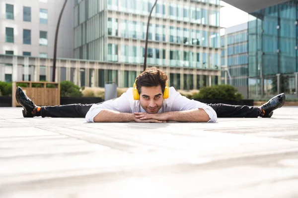 Happy Handsome Adult Businessman Wearing Elegant Suit Doing Acrobatic Trick — Stockfoto