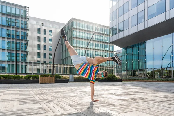 Happy Handsome Adult Man Wearing Colorful Shirt Doing Acrobatic Trick — Stockfoto