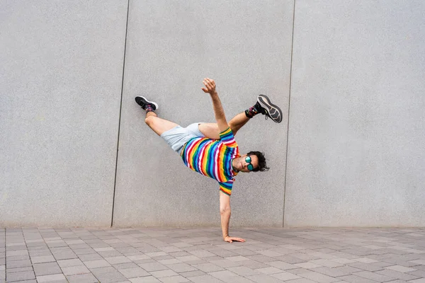 Happy Handsome Adult Businessman Wearing Elegant Suit Doing Acrobatic Trick — стоковое фото