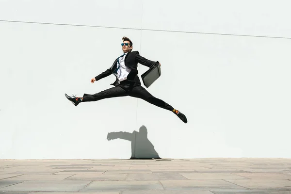 Happy Handsome Adult Businessman Wearing Elegant Suit Doing Acrobatic Trick — стоковое фото