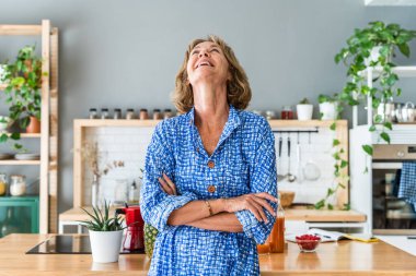 Beautiful mature senior woman at home, domestic life and leisure moments - 50-60 years old pretty female adult