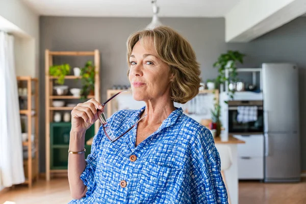 Beautiful mature senior woman at home, domestic life and leisure moments - 50-60 years old pretty female adult portrait, concept about healthy lifestyle, beauty and anti-aging