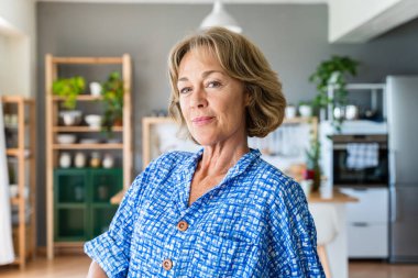 Beautiful mature senior woman at home, domestic life and leisure moments - 50-60 years old pretty female adult portrait, concept about healthy lifestyle, beauty and anti-aging