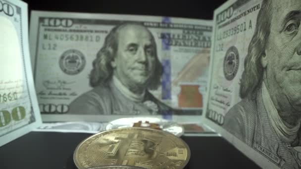 Crypto currency, bitcoin. BTC, Bit Coin. Blockchain technology, bitcoin mining. Macro shot of rotating bitcoins. USA Dollar bill — Stock Video