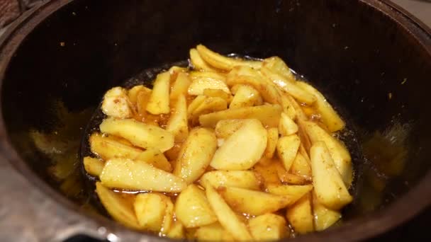 Cooking french fries in the deep fryer, crispy fries, Junk food concept. Tasty food. Family concept. Slow motion shot — Stock Video