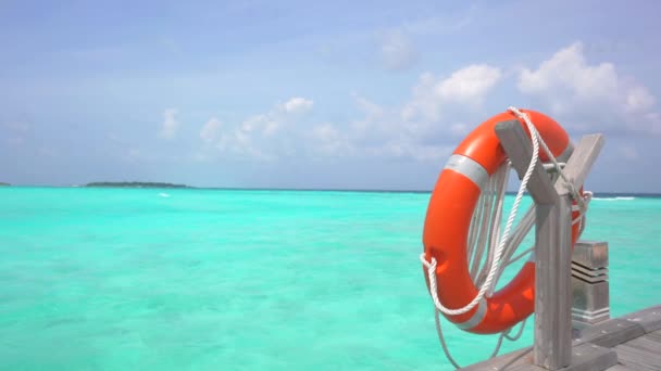 Orange Safety Lifebelt In ocean. Safety swim. Luxory resort for vacation. life saving buoy in open ocean dangerous water. Metaphor to prevent person from drowning concept. No people — Stock Video