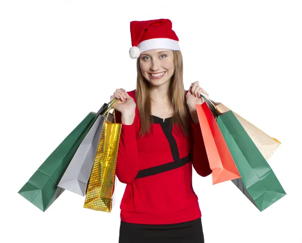 Молодая покупательница в рождественской шляпе — стоковое фото