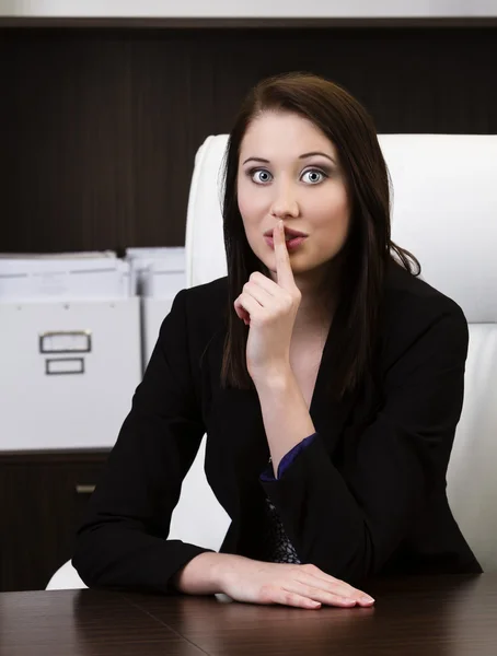 Young businesswoman showing quiet sign — Stock Photo, Image