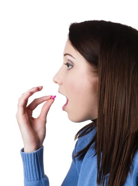 Woman taking pill — Stock Photo, Image