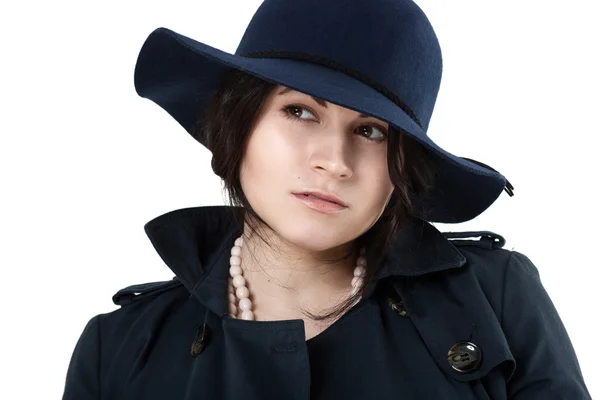 Portrait of a young coquette in blue hat Stock Image