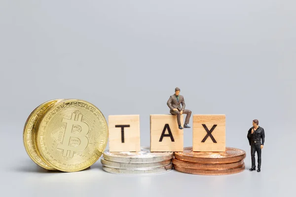 Miniature People Businessman Crypto Currency Wooden Letters Tax Gray Background — Stock Photo, Image