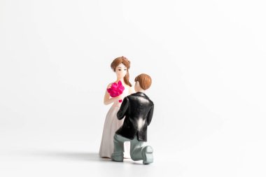 Miniature people Bride and groom wedding on grey  background ,Happy Valentines Day concept
