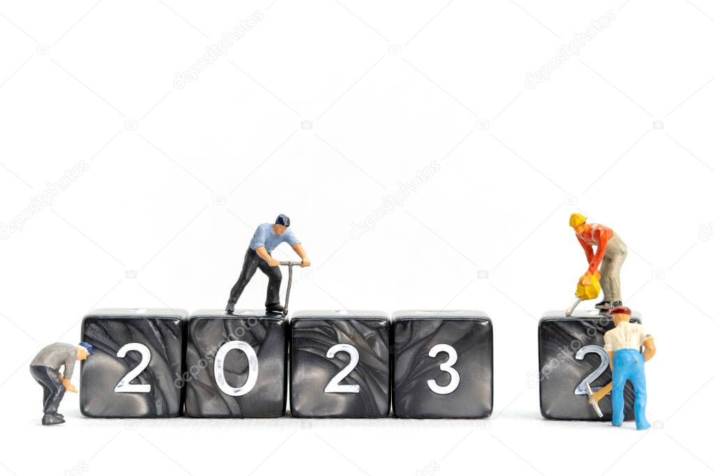 Miniature People Worker Team Create Number 2023 On Block , Happy New Year Concept