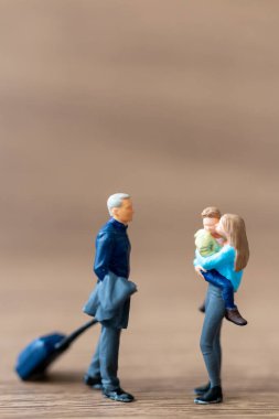 Miniature people ,Happy family talking getting ready to go travel,family day concept