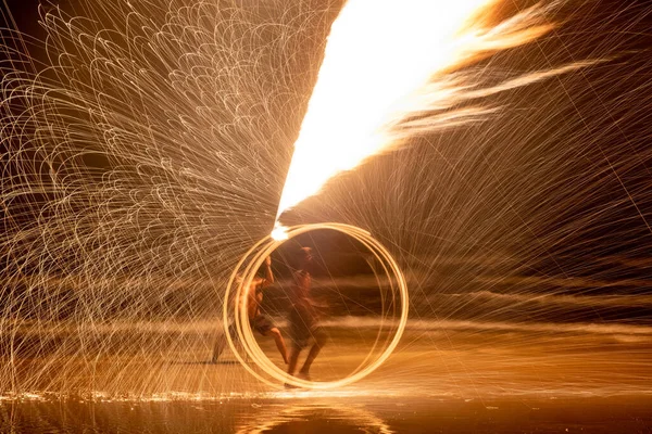 Fire dancers Swing fire dancing show fire show on the beach dance man juggling with fire