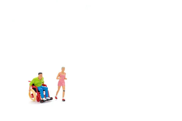 Personnes Miniatures Femme Gaie Avec Jeune Homme Handicapé Fauteuil Roulant — Photo