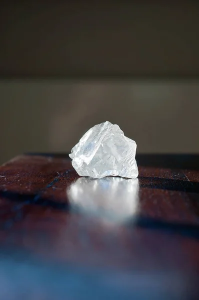 Healing crystals Clear Quartz on a wooden table. Gemstones are full of healing energy and good vibes.