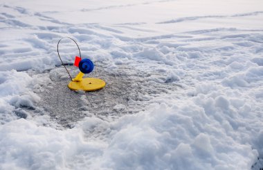 Winter fishing on ice clipart